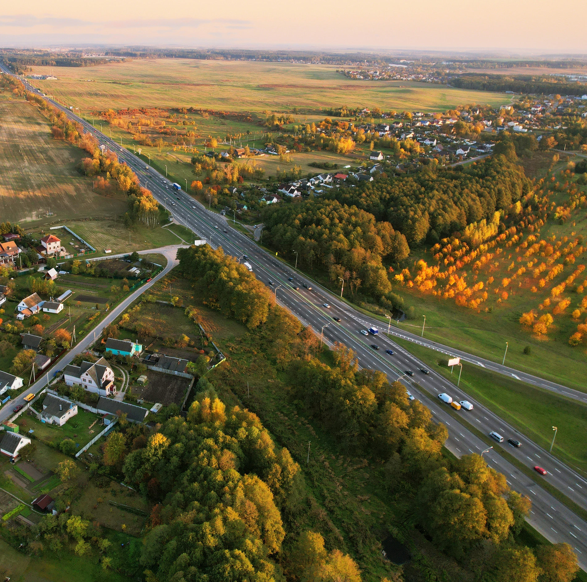 Suburb,Houses,In,Rural,,Aerial,View.,Car,And,Truck,Driving
